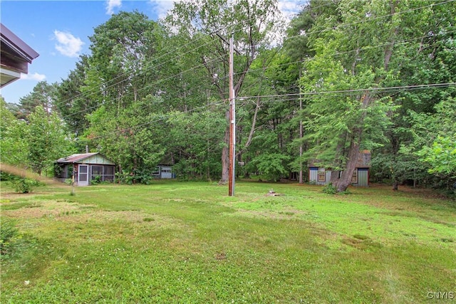 6736 Pine Grove Rd, Watson, NY 13343 - view of green lawn featuring an outbuilding