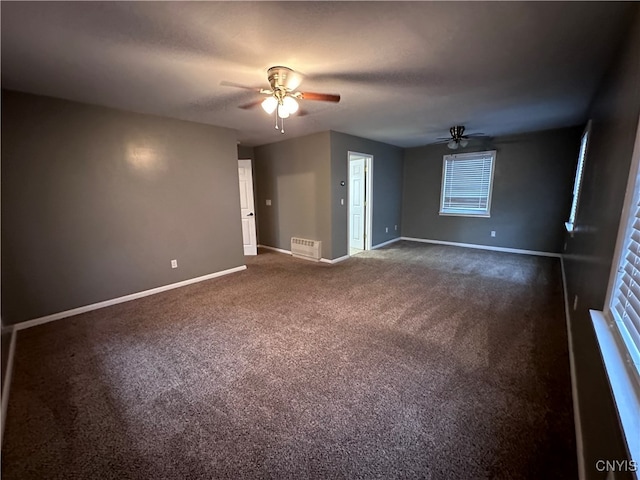 carpeted empty room featuring ceiling fan