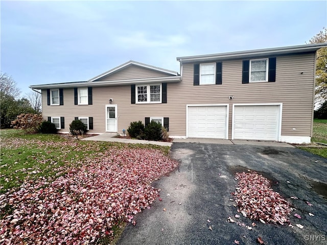 bi-level home featuring a garage