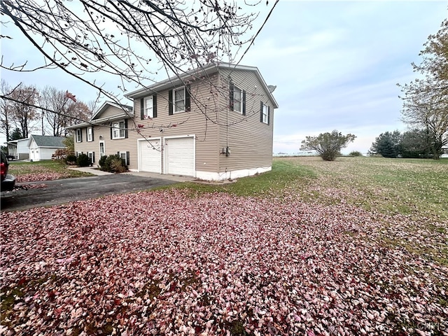 view of property exterior with a garage