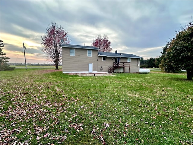 back of house with a yard