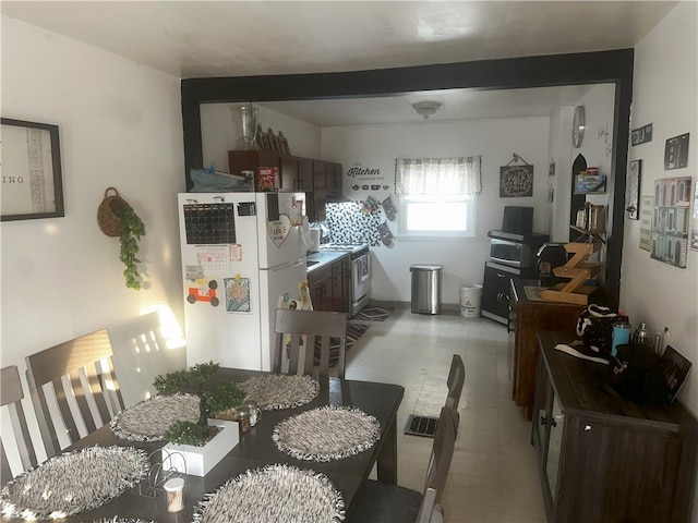 dining room featuring light tile patterned floors