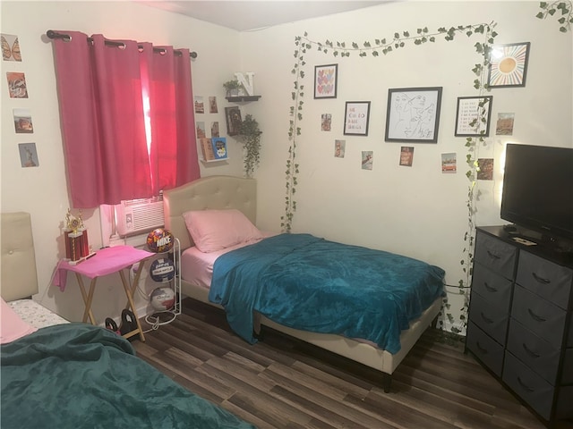 bedroom featuring cooling unit and dark wood-type flooring