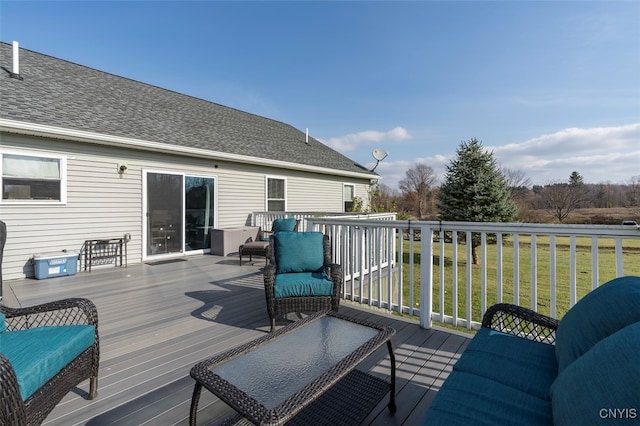 wooden deck with a lawn