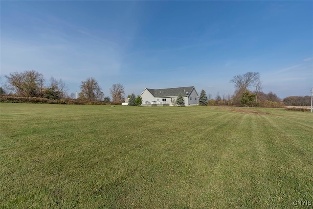 view of yard with a rural view