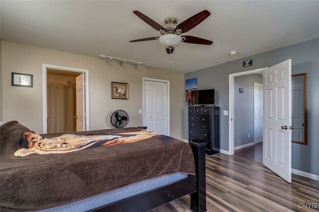 bedroom featuring a closet, dark wood-type flooring, and ceiling fan