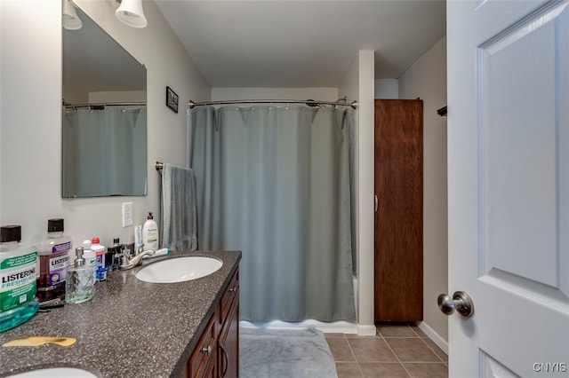 bathroom featuring vanity, curtained shower, and tile patterned floors