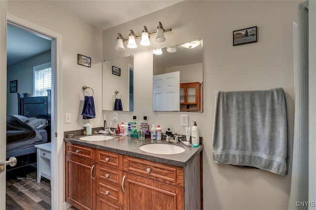 bathroom with vanity and hardwood / wood-style floors