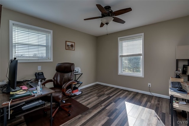 office with dark wood-type flooring and ceiling fan