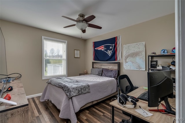 bedroom featuring ceiling fan and dark hardwood / wood-style floors