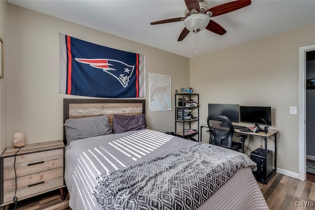 bedroom with wood-type flooring and ceiling fan