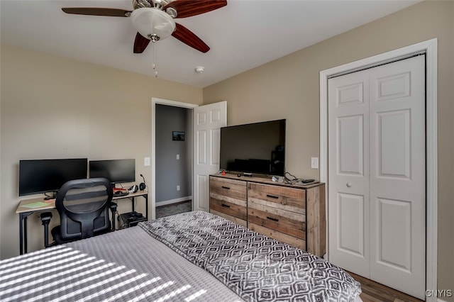 bedroom with a closet, wood-type flooring, and ceiling fan