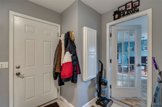 doorway to outside with french doors and light tile patterned floors