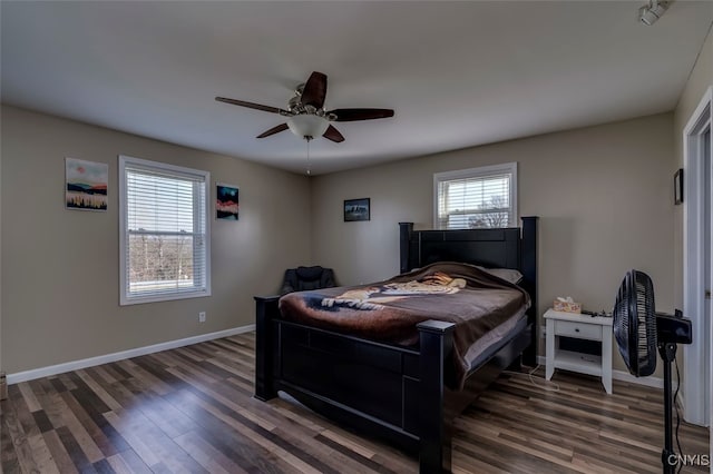 bedroom featuring dark wood-type flooring and ceiling fan