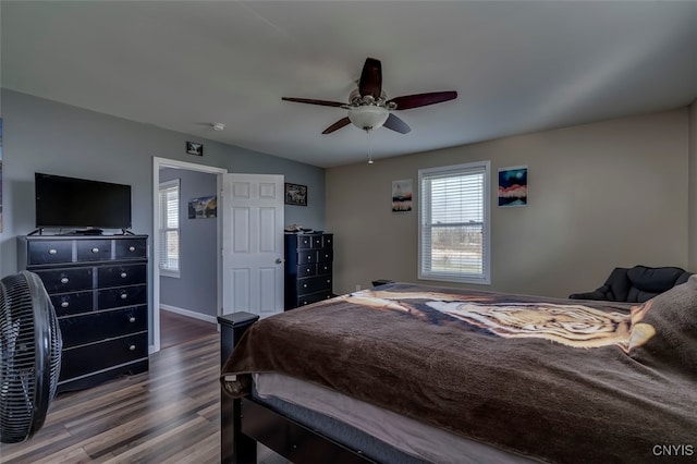 bedroom featuring hardwood / wood-style flooring and ceiling fan