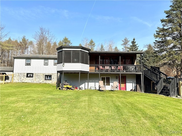 back of house with a yard and a deck