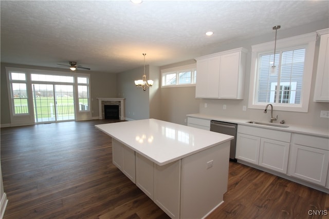 kitchen featuring dishwasher, white cabinets, and dark hardwood / wood-style flooring