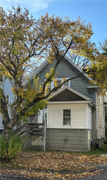 view of home's exterior featuring a wooden deck