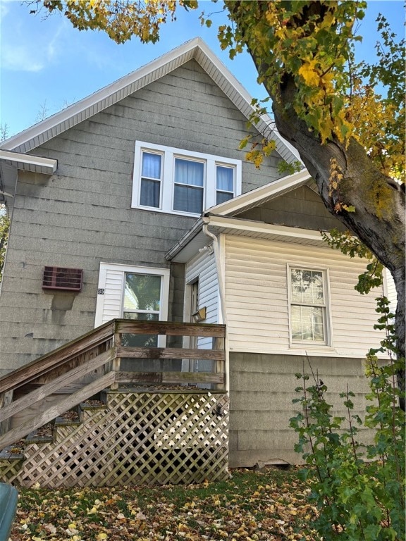 back of house with a wooden deck