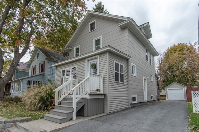 view of front of home with an outdoor structure and a garage