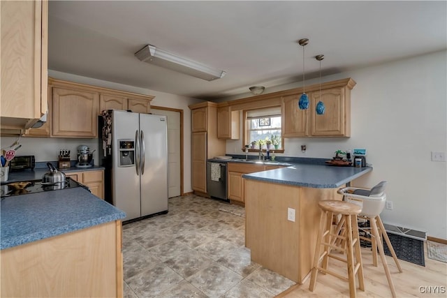 kitchen featuring light brown cabinets, hanging light fixtures, kitchen peninsula, dishwashing machine, and stainless steel fridge with ice dispenser