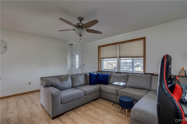 living room with ceiling fan and light hardwood / wood-style floors