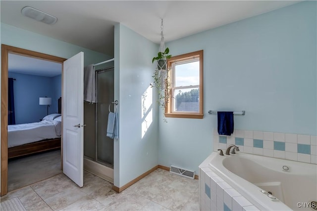 bathroom with shower with separate bathtub