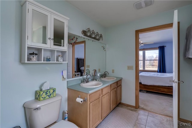 bathroom with ceiling fan, tile patterned floors, vanity, and toilet