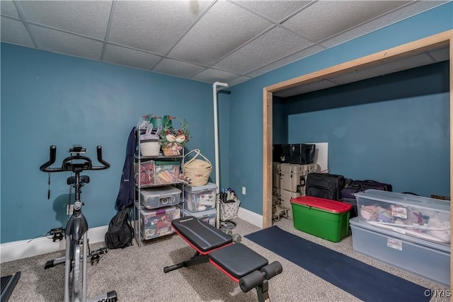 workout room with a paneled ceiling