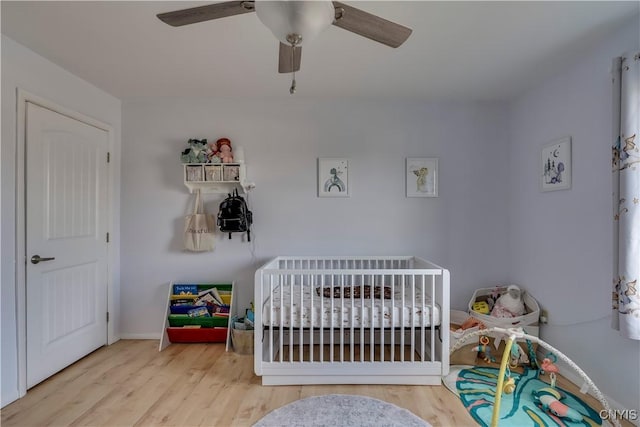 bedroom with ceiling fan and light wood-type flooring