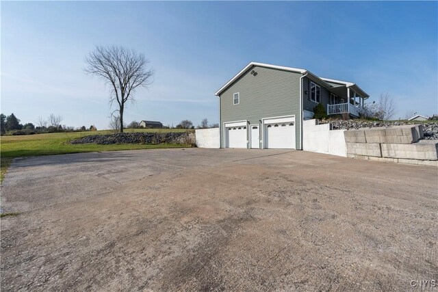 view of side of home featuring a garage