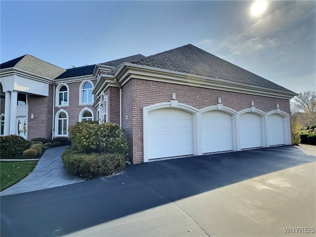 view of property exterior with a garage