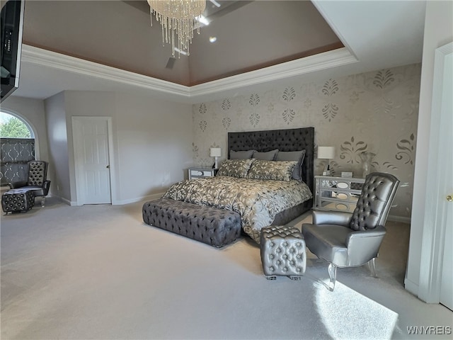 bedroom featuring crown molding, light carpet, and a raised ceiling