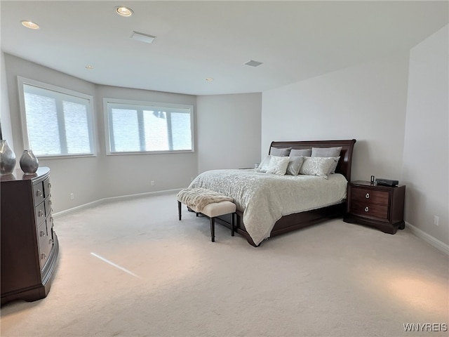 bedroom featuring light colored carpet