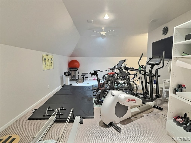 workout room with vaulted ceiling, light colored carpet, and ceiling fan