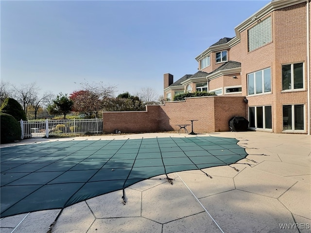 view of pool featuring a patio