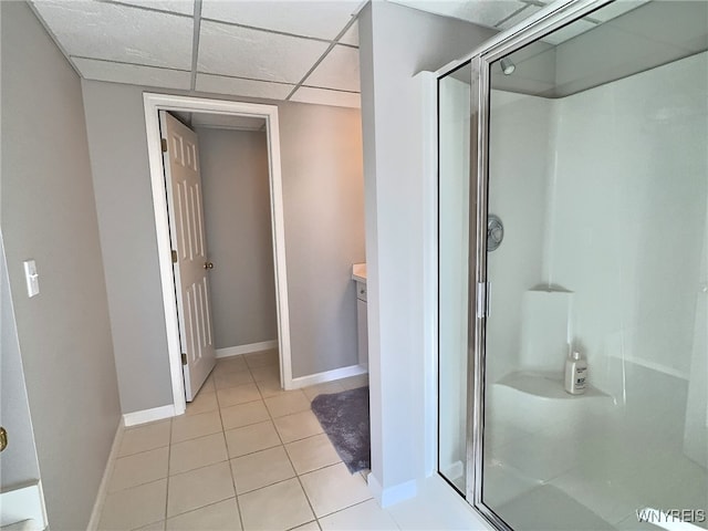 bathroom featuring vanity, tile patterned floors, a paneled ceiling, and walk in shower