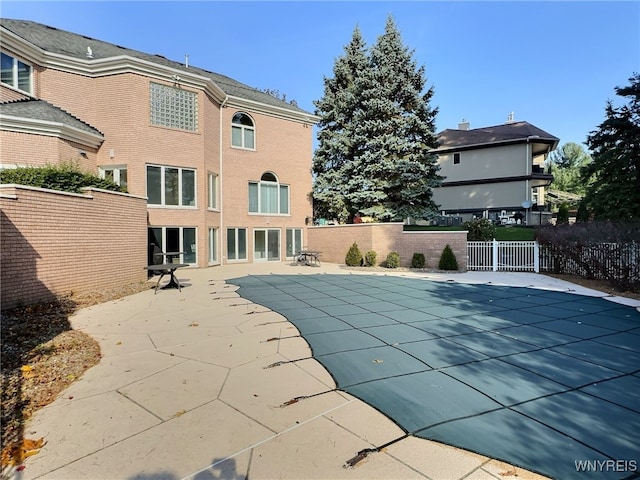 view of swimming pool featuring a patio