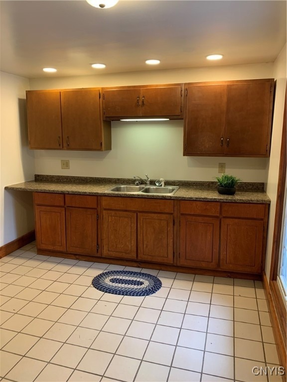 kitchen with sink and light tile patterned floors