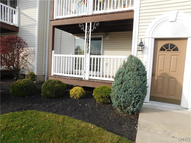 property entrance with a balcony