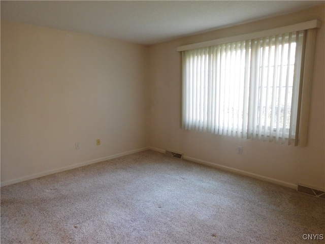 empty room featuring light colored carpet