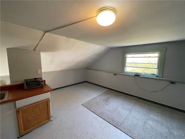 bonus room featuring lofted ceiling