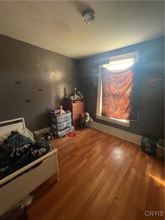 bedroom featuring wood-type flooring