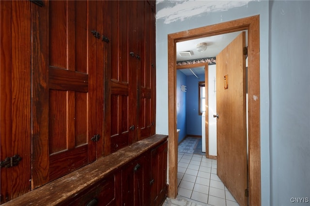 hallway with light tile patterned flooring