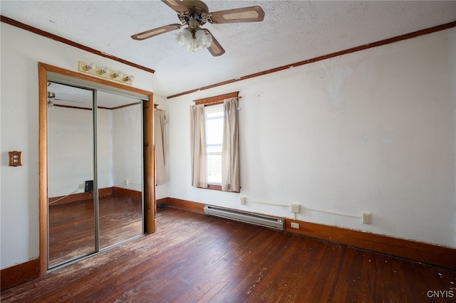 unfurnished bedroom with dark hardwood / wood-style floors, a closet, baseboard heating, a textured ceiling, and ceiling fan