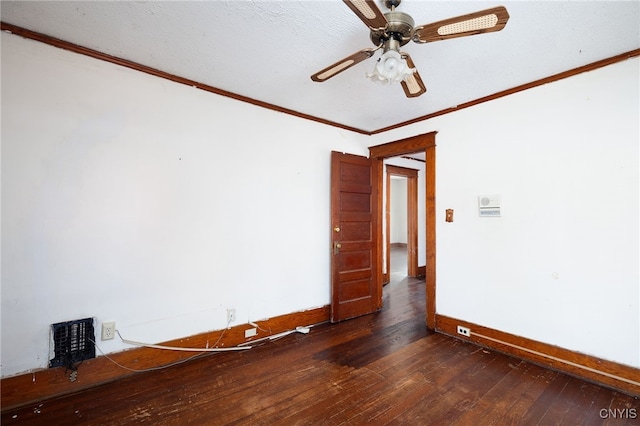 empty room featuring ornamental molding, dark hardwood / wood-style floors, a textured ceiling, and ceiling fan