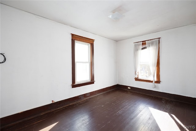 spare room featuring hardwood / wood-style floors