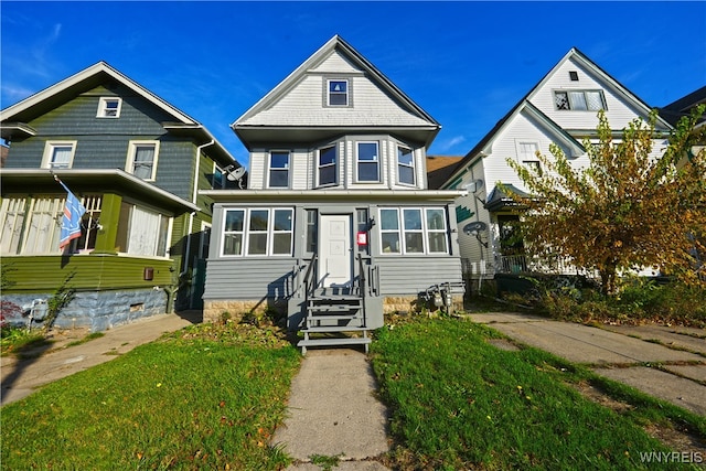 view of front of property with a front lawn