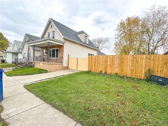 view of property exterior featuring a lawn