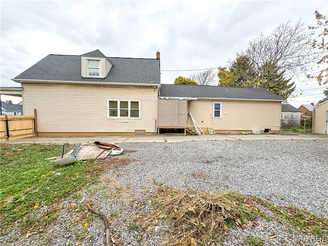 back of property with a patio